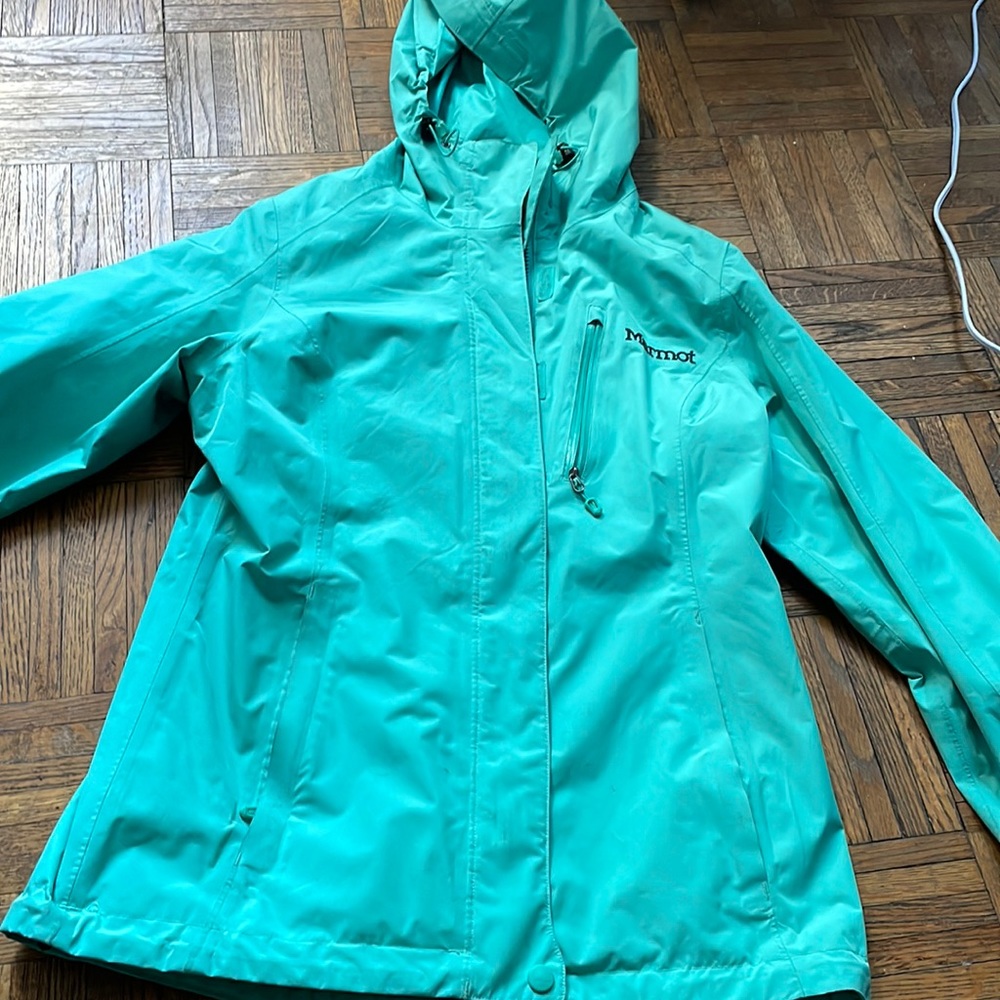 Manomet rain jacket. It is green/ turquoise looking.